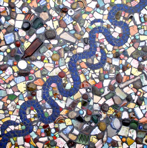"River Meanders" mosaic art. ceramics, glass, pebbles, marbles, found objects on panel. 24 in x 24 in