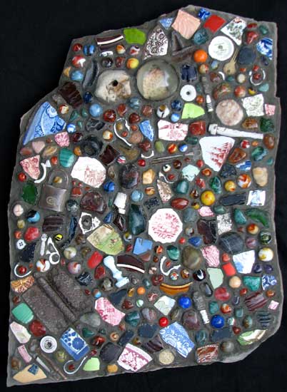 "Rosetta Stone" contemporary mosaic. gemstones, marbles, porcelain and found objects on standstone. about 30 in.