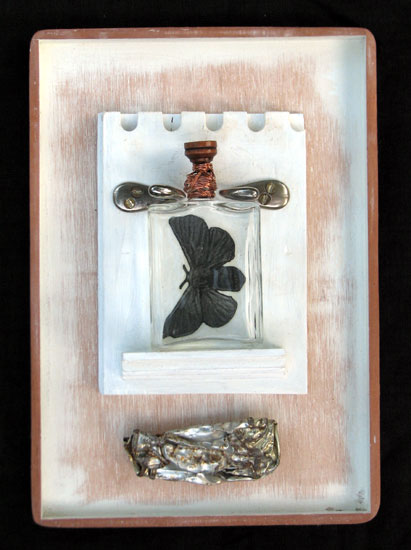 "Soul Bottle" assemblage sculpture. found objects, wood, adhesive, acrylic paint. 8.25 in x 11.75 in x 2.25 in.