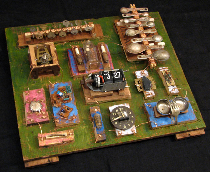 "Time Machine" assemblage sculpture. found objects, copper wire, tacks, wood, adhesive, acrylic paint. 21 in x 20 in x 6 in.